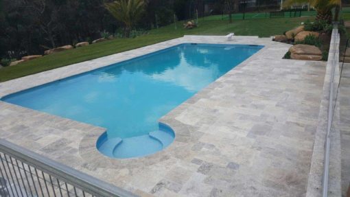 Silver Grey French Pattern Travertine with a light blue pool