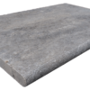 Bullnosed grey pool coping tile with rounded edge on one long side