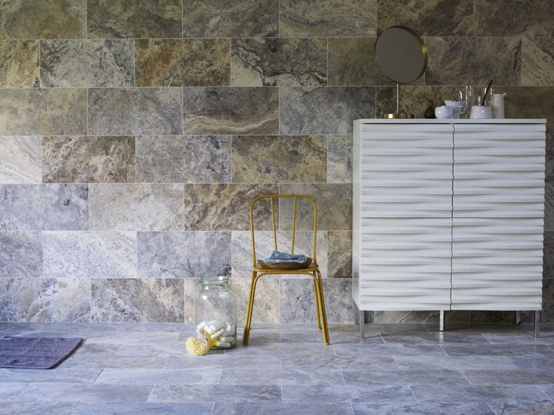 Travertine in a silver and grey colour tone on a bathroom floor and wall