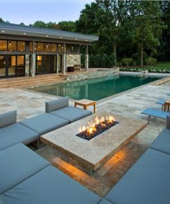 Brown travertine paving with built in external furniture