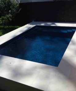 Limestone edge tiles on an aboveground pool