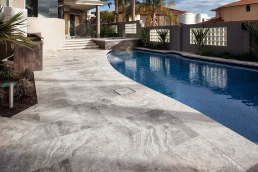 Curved silver travertine bullnose coping